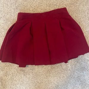 Pleated maroon skater skirt Size M has pockets